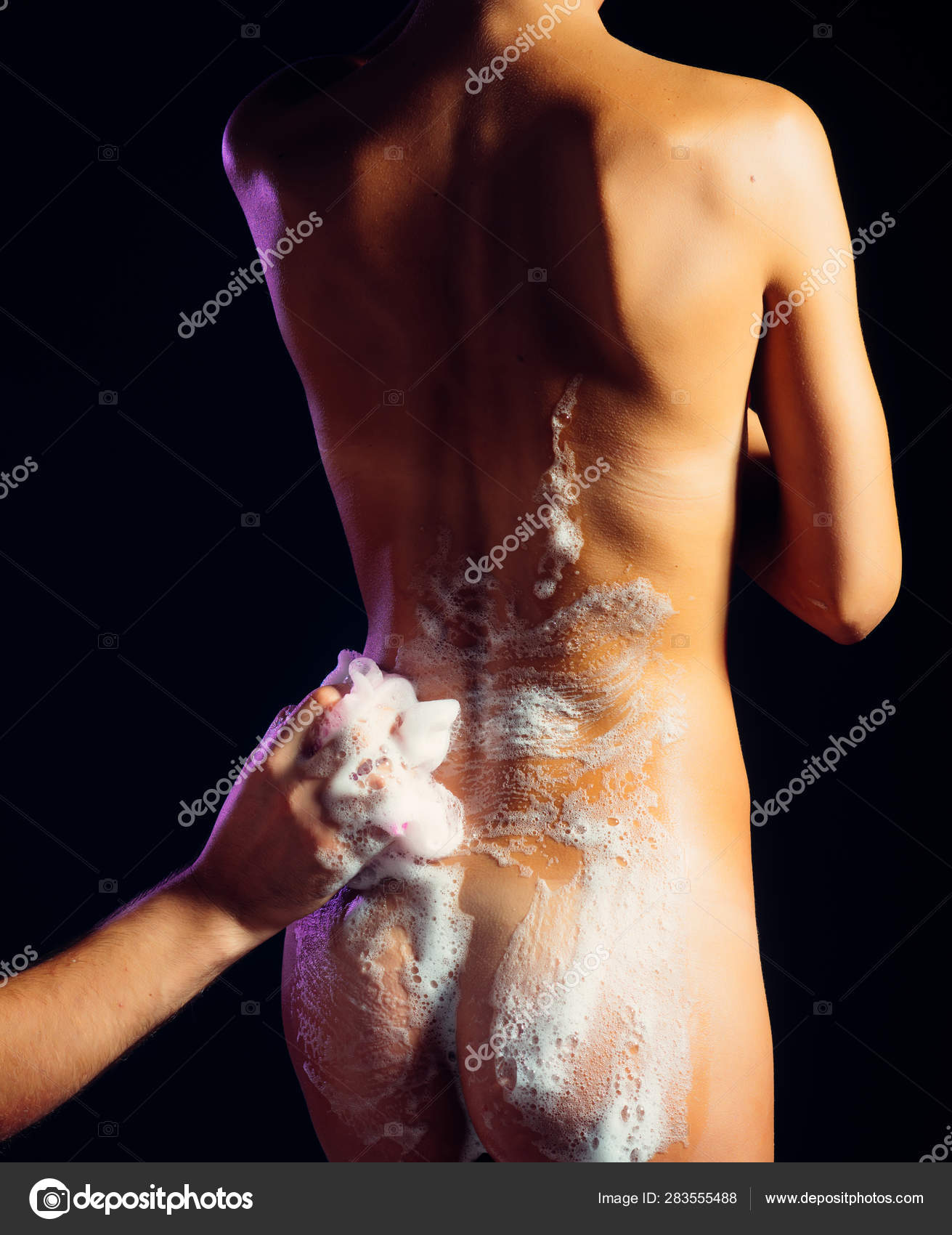 Man washing nude girl