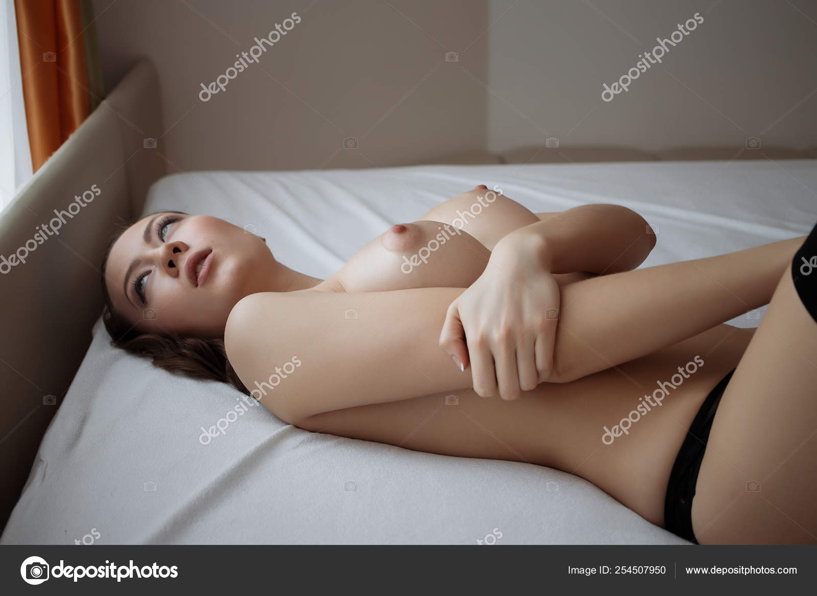 https://st4n.depositphotos.com/5034975/25450/i/1600/depositphotos_254507950-stock-photo-young-sensual-naked-woman-posing.jpg